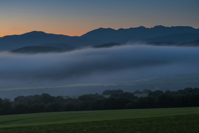 Misty mountain valley at dawn — atmospheric horizon